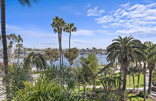 Balboa Peninsula Condo | Fully Furnished Executive Condo-Ocean Views, steps to Lido Village and the beach