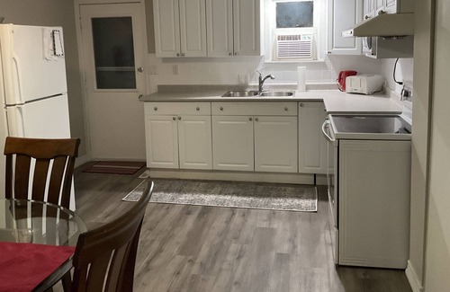 London Apartment | Furnished inclusive 1 bed + large den parking laundry patio suitcase ready