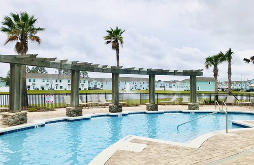 Thomas Drive House | Game Room, mins to beach, Pier Park and Sports Complex, POOL, pond view