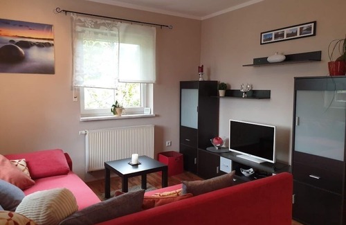 Neubau Apartment | Gemütliche Ferienwohnung mit eigenem Kaminofen und Balkon