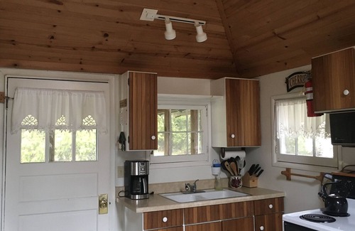 Baileys Harbor Cottage | Get away at this quaint cottage tucked behind a beautiful fern bed.