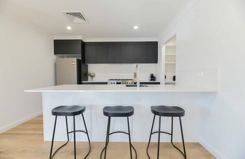 Orange House | Getaway on Curran | CBD Escape, EV Plug, Firepit