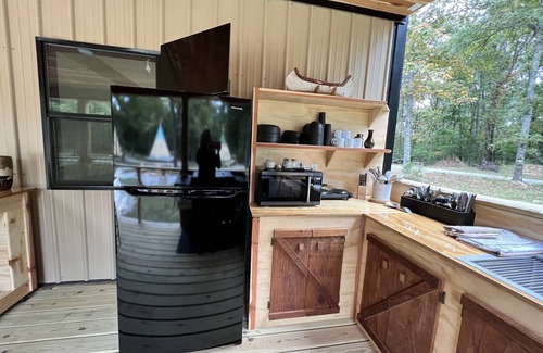 Newnata RV Rental | Glamping in an Authentic Style Sioux Tipi in the Heart of the Ozarks “The Wolf”