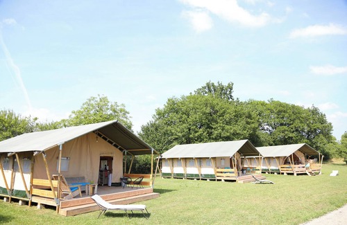 Jayac RV Rental | Glamping 'Safarilodge Prestige Tent 12 5 Pers' with Shared Pool, Wi-Fi and Air Conditioning