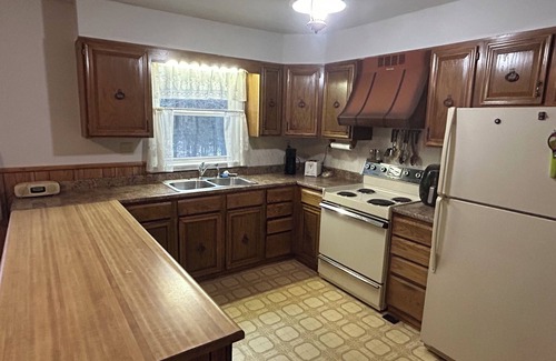Taberg House | Glenmore Creek, ranch style home located on 10, mostly wooded, private acres.