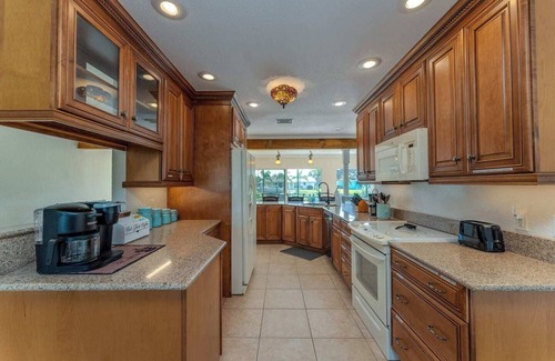 Port Charlotte House | GoGo House. Charming 2 BR, 2 BA, Waterfront Vacation Rental in Port Charlotte, FL, w/Heated Private Pool & Spa