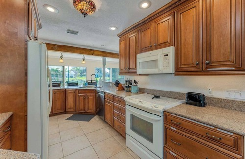 Port Charlotte House | GoGo House. Charming 2 BR, 2 BA, Waterfront Vacation Rental in Port Charlotte, FL, w/Heated Private Pool & Spa