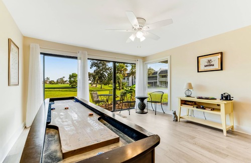 Upper Grand Lagoon Condo | Golf course-adjacent home with shuffleboard table & furnished patio