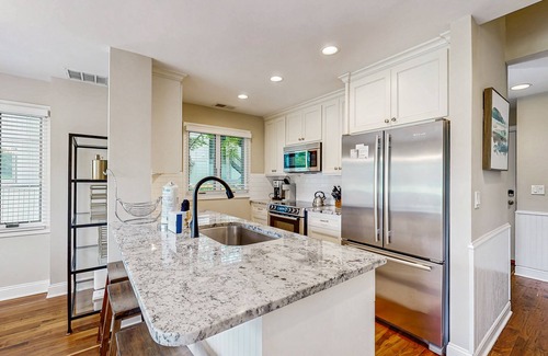 West Beach Village House | Golf-view villa with private deck, AC, & W/D - walk to beach - dog-friendly