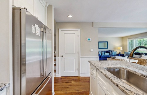 West Beach Village House | Golf-view villa with private deck, AC, & W/D - walk to beach - dog-friendly