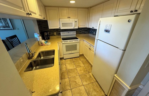 Shelter Cove Condo | Gorgeous 2 bedroom villa overlooking Shelter Cove Harbour with pool and spa