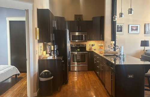 West Central Apartment | Gorgeous 3 bedroom Downtown loft apartment with private balcony & rooftop deck.