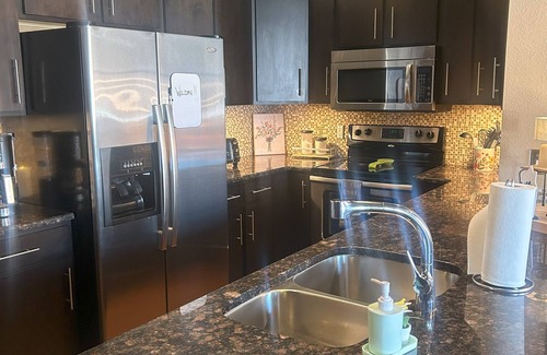 West Central Apartment | Gorgeous 3 bedroom Downtown loft apartment with private balcony & rooftop deck.