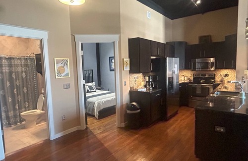 West Central Apartment | Gorgeous 3 bedroom Downtown loft apartment with private balcony & rooftop deck.