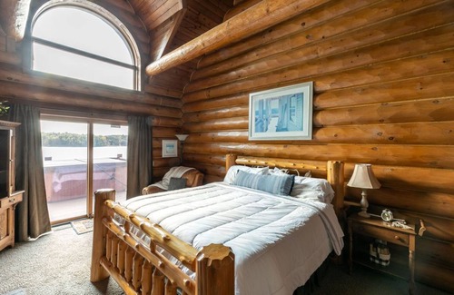 Wautoma Cabin | Gorgeous 7 bdrm loglodge fireplaces sauna hottub sleeps 24 great view pier boats