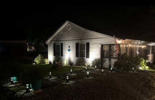 Shallotte House | Gorgeous creekside cottage with firepit, board games, dock, deck, & washer/dryer