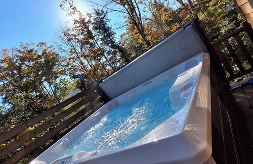 Carrabassett Valley Cabin | Gorgeous dog-friendly cabin with great view, deck, hot tub, & gas fireplace