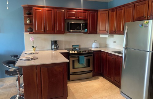 Coco Sunset Hills Condo | Gorgeous Poolside Condo w/Rooftop Deck - blocks from the beach -