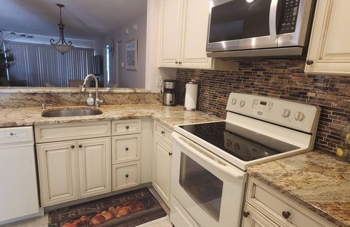 Casa del Mar Condo | Gorgeous Second Floor Waterfront Villa with Sunset views over Boca Ciega Bay!