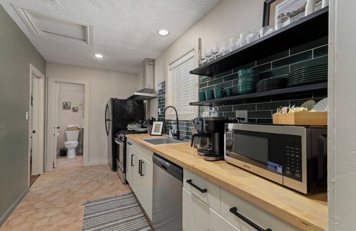 Downtown House | Gothic Garden Bright, Cozy Escape with Modern Touches in Historic Bryan