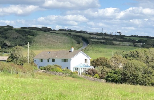 Crynant House | Gower Rhossili sleeps 12. Seaside, holiday home with large garden.