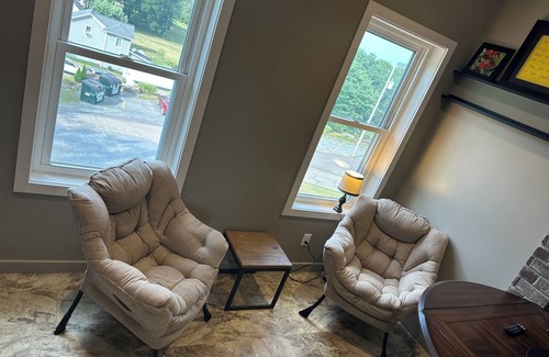 Sugarcreek Apartment | Great bedroom with private bathroom & Lounge above a local Diner