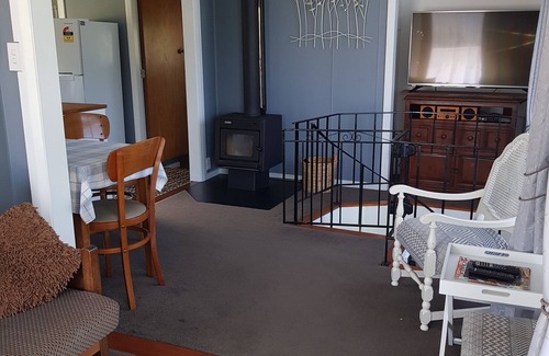 Okiwi Bay House | Great views from this double storey bach. Very close to sandy beach.