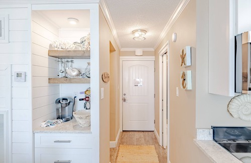 Panama City Beach Condo | Ground Floor Beachside Studio Condo with Patio and Free Beach Service.