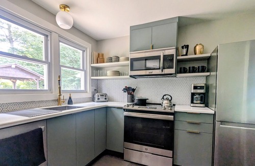 Swannanoa House | Grovemont Retro Retreat A pet-friendly home in Asheville, with a fenced yard & fire pit.