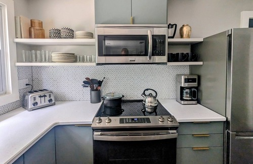 Swannanoa House | Grovemont Retro Retreat A pet-friendly home in Asheville, with a fenced yard & fire pit.