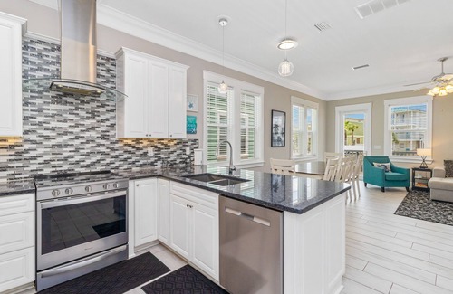 Waterside Village House | Gulf & canal views with modern amenities, pool, & beach access