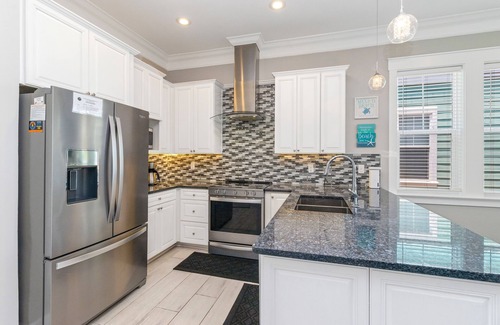 Waterside Village House | Gulf & canal views with modern amenities, pool, & beach access