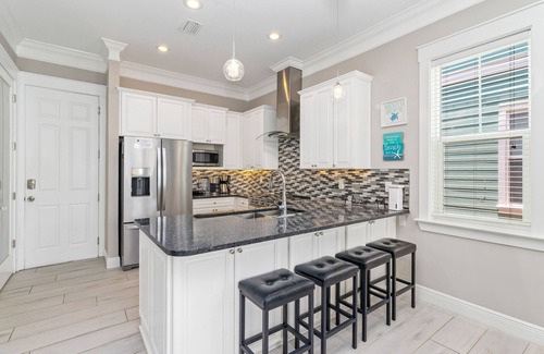 Waterside Village House | Gulf & canal views with modern amenities, pool, & beach access