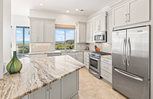 Seawalk Circle House | Gulf Front! Steps to the Beach! Professionally Decorated! Low-Speed Vehicle! 3 Adult Bikes!