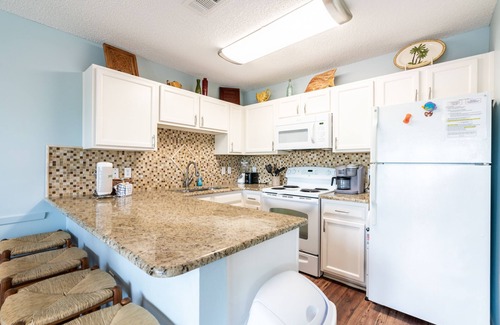 Crystal Beach Condo | Gulf view, direct beach access, heated pool, hot tub