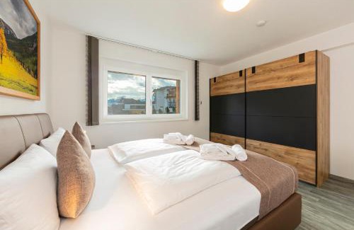 Fuegen House | H19 - Modernes Ferienhaus 145qm, 3SZ, Wellnessbereich mit Sauna und Dachterrasse mit Panoramablick, Kühlen und Heizen mit Geothermie