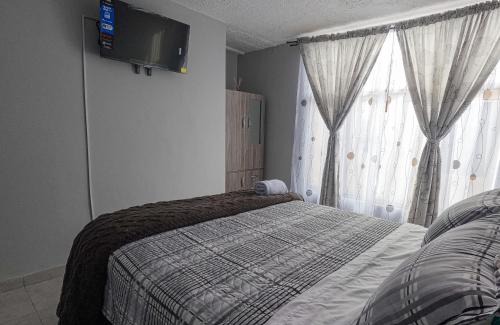 Calle 26 Hotel | Habitación Privada en Kzona, Cerca al aeropuerto, Ideal para Escalas y Trámites