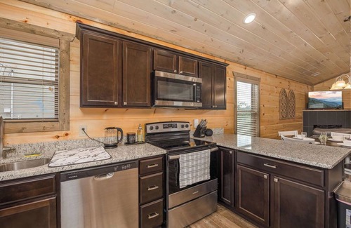 Sevierville Cabin | Happy Bear: Wooded Views, Fire-Pit, Game Room & Hot-Tub, Close to Attractions