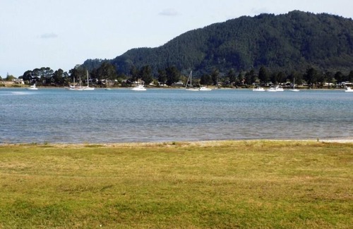 Tairua House | Harbour Views 30 metres from the sea and sand beach.