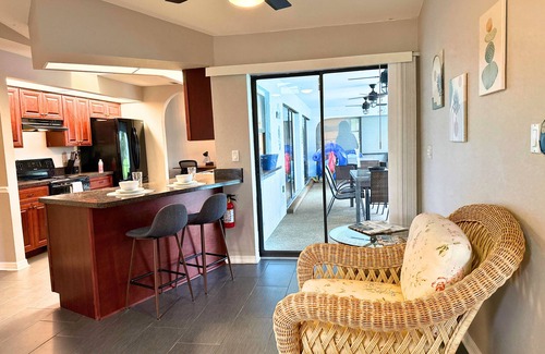 Pebble Beach House | !HEATED POOL/LANAI-BBQ-CANAL WATERFRONT-NEAR BEACH/GOLF/PARK/TENNIS/RESTAURANTS!