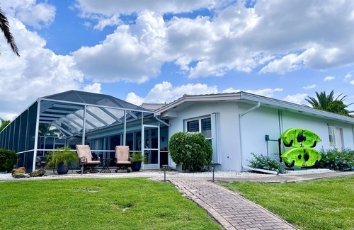 Punta Gorda House | Heated pool, Tropical waterfront home , Dock, Gulf access minutes from downtown.