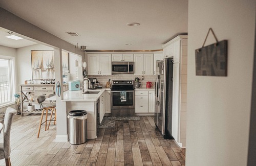 Portage Lakes Cottage | HEAVENLY Portage Lakes water front 4-bedroom cottage with HOTTUB, dog friendly!