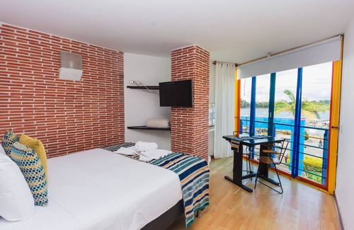 Guatape Hotel | Hermosa Habitación Suite Deluxe En Guatape