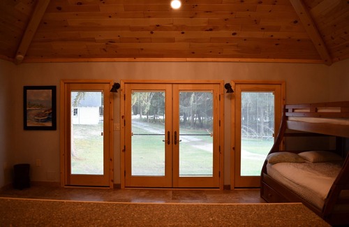 Higgins Lake House | Higgins Lake frontage Small Guest House With Shared Beach, Yard and Dock.
