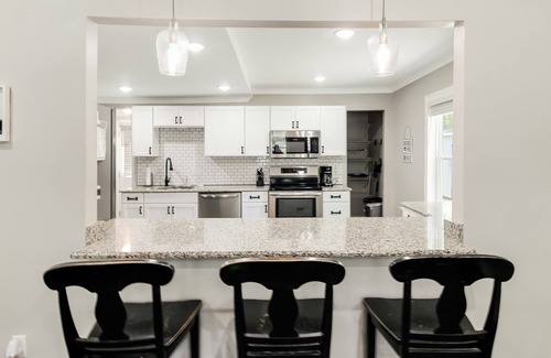 Southport Cottage | Historic dog-friendly renovated cottage with streaming, patio, W/D, & AC