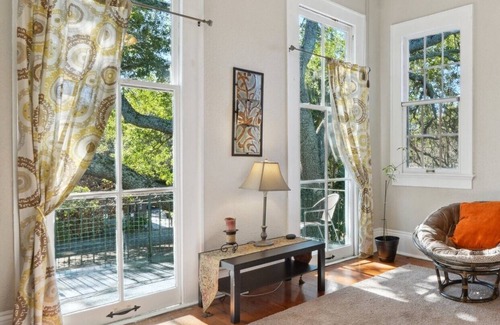 Seventh Ward Apartment | Historic Property With Balcony Lookout into Trees and Pre Civil War buildings.
