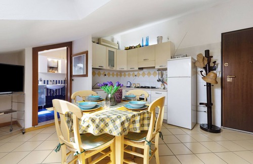 Caorle Apartment | Holiday Apartment "Mansarda Di Ponente" near Beach with Shared Garden & A/C