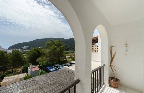 Santa Eulalia del Rio House | Holiday Home "Casita en Cala Llonga" with Sea View, Shared Garden & Pool