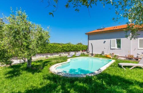 Cecina House | Holiday Home Garden by Interhome