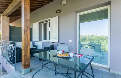 Cecina House | Holiday Home Garden by Interhome